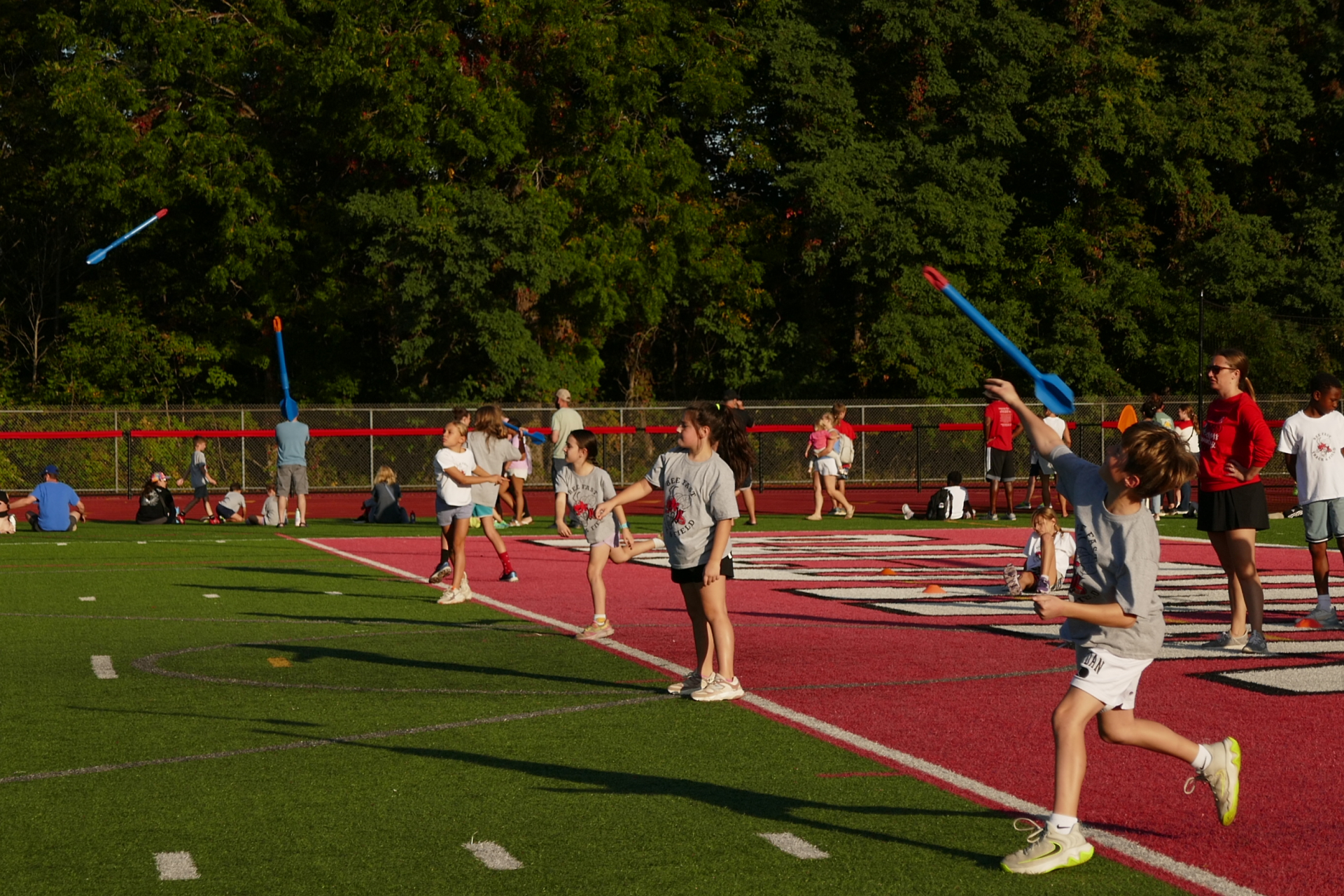 Children throwing javelins